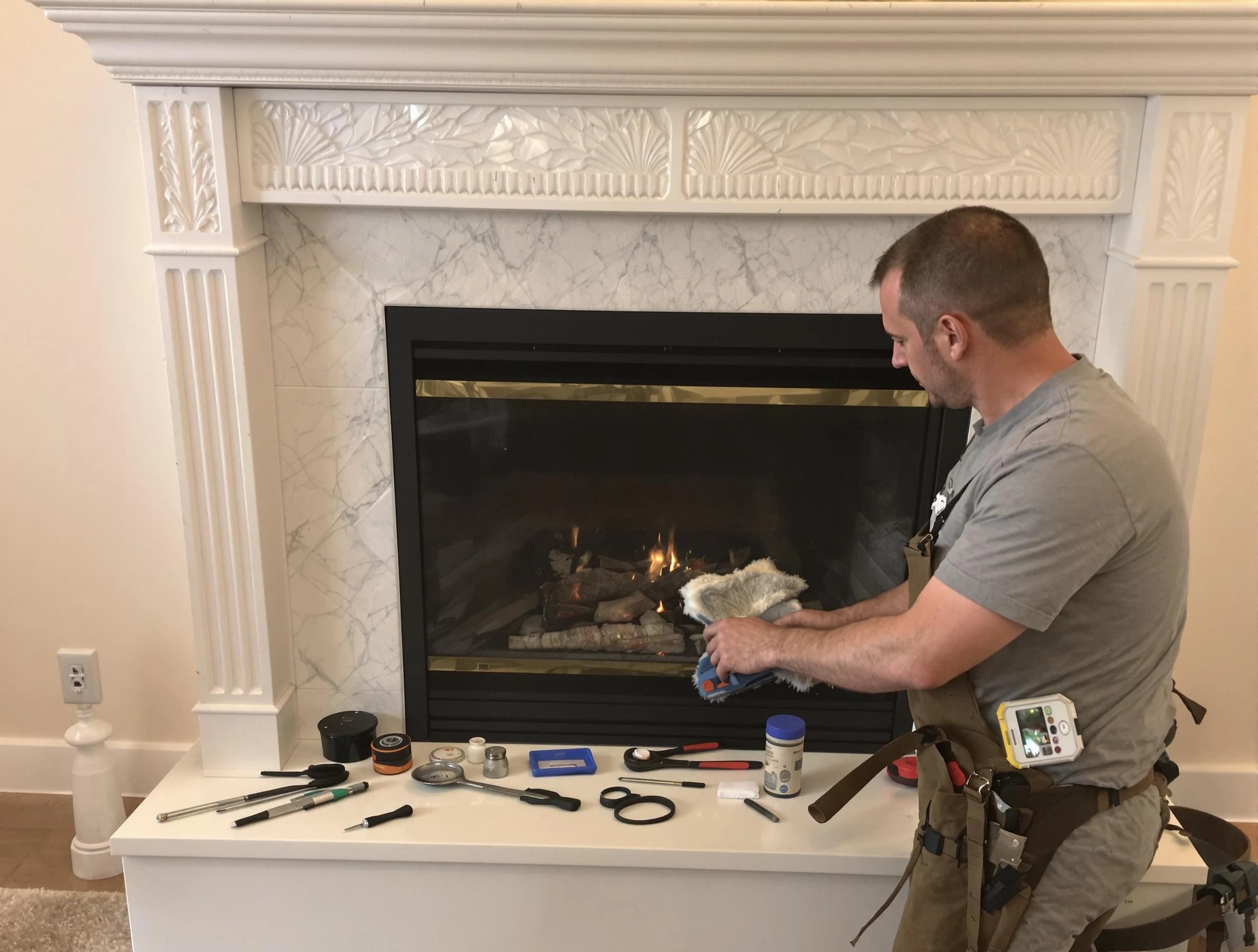 Westford Chimney Sweep performing fireplace maintenance in Westford, MA